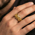 Load image into Gallery viewer, Gold plated skull ring worn on the finger, lifestyle photo emphasizing luxury warmth, standout skull focal point, and gift-ready impact.
