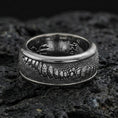 Load image into Gallery viewer, Oxidized sterling silver lizard skin spinner ring on volcanic stone, macro close-up highlighting reptile-scale texture and deep shadowed contrast on the rotating band.
