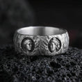 Load image into Gallery viewer, Oxidized sterling silver Greek sculpture ring on volcanic stone, macro close-up focusing on the twin cameo portraits, deep shadowing, and rugged antique patina.
