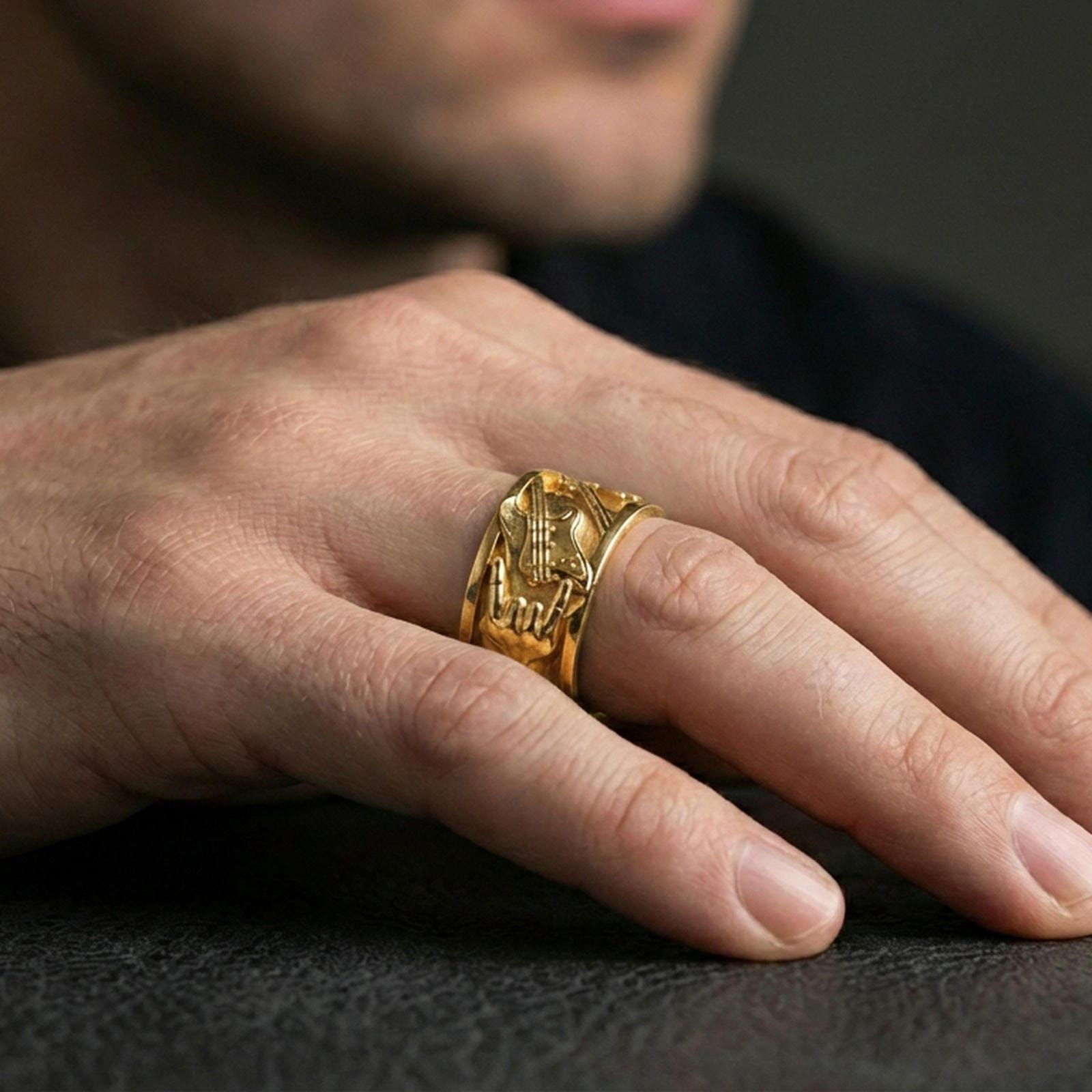 Gold plated guitar ring worn on the finger, lifestyle photo emphasizing strong gold presence, stage-inspired character, and premium finish appeal.