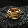 Load image into Gallery viewer, Gold plated layered studded band ring on volcanic stone, luxury macro photo showcasing warm gold tone across the rivet-like dots and sculpted band layers.
