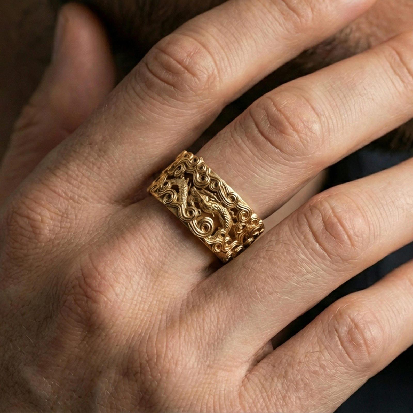 Gold plated dragon cloud band ring worn on the finger, lifestyle photo emphasizing rich gold glow, strong dragon symbolism, and premium visual impact.