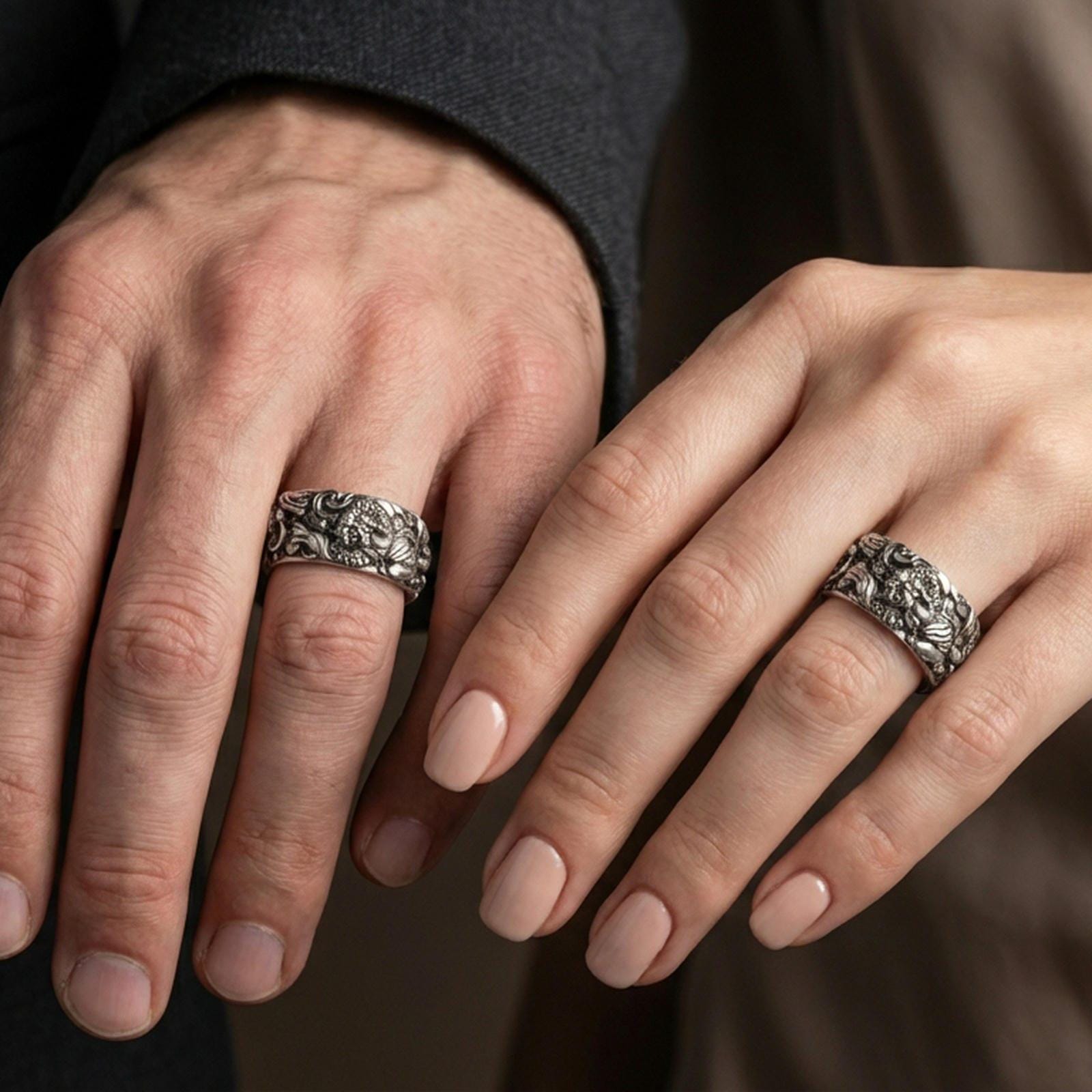 Oxidized sterling silver guardian lion band ring worn on the finger, lifestyle image presenting bold contrast, powerful symbolism, and a rugged statement look.
