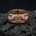 Load image into Gallery viewer, Rose gold plated protective eye ring on volcanic stone, refined macro close-up showcasing soft rose warmth, dimensional hand sculpture, and detailed eye centerpiece.
