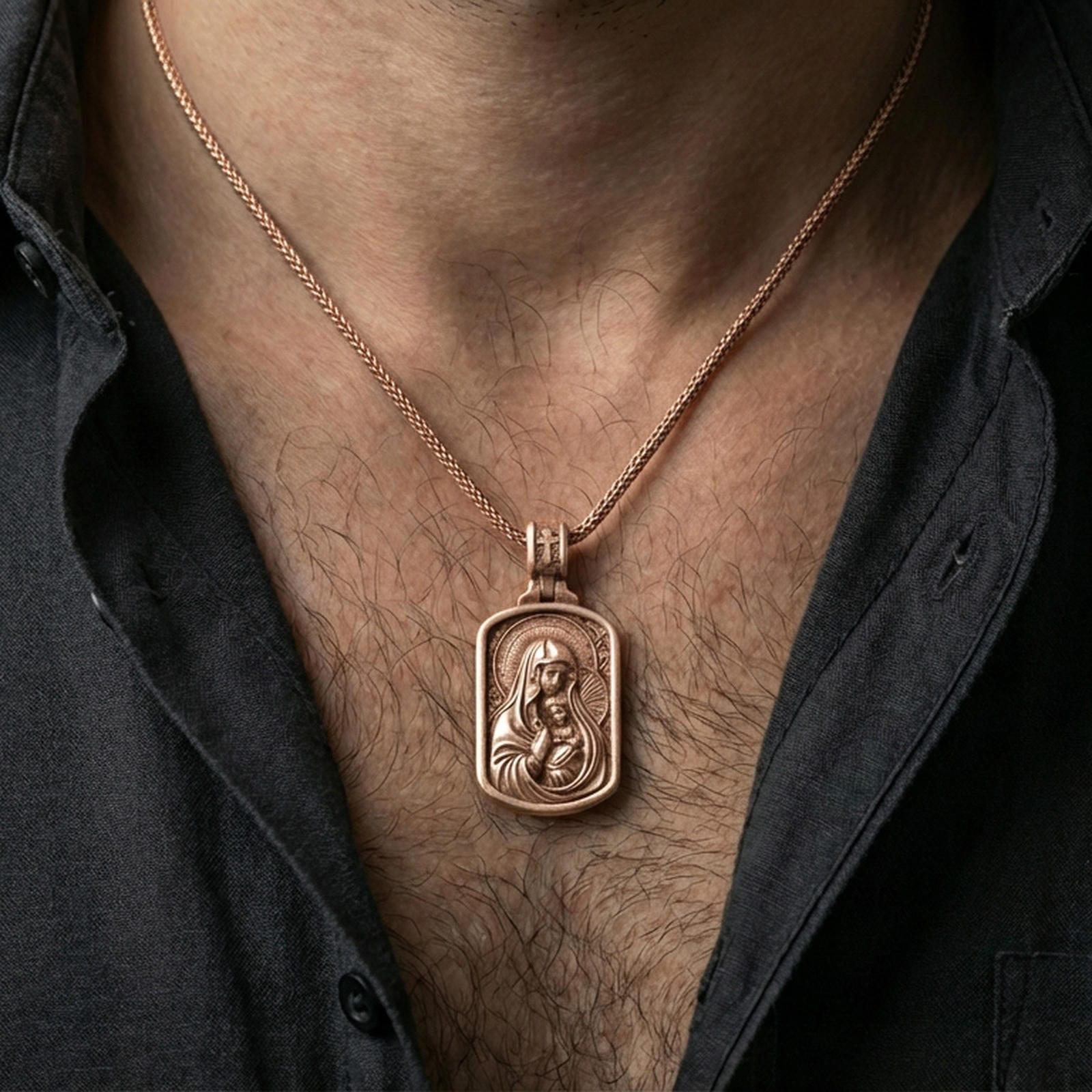 Rose gold plated Madonna and Child pendant with framed devotional relief worn on the neck in a refined lifestyle shot with a warm and elegant presentation