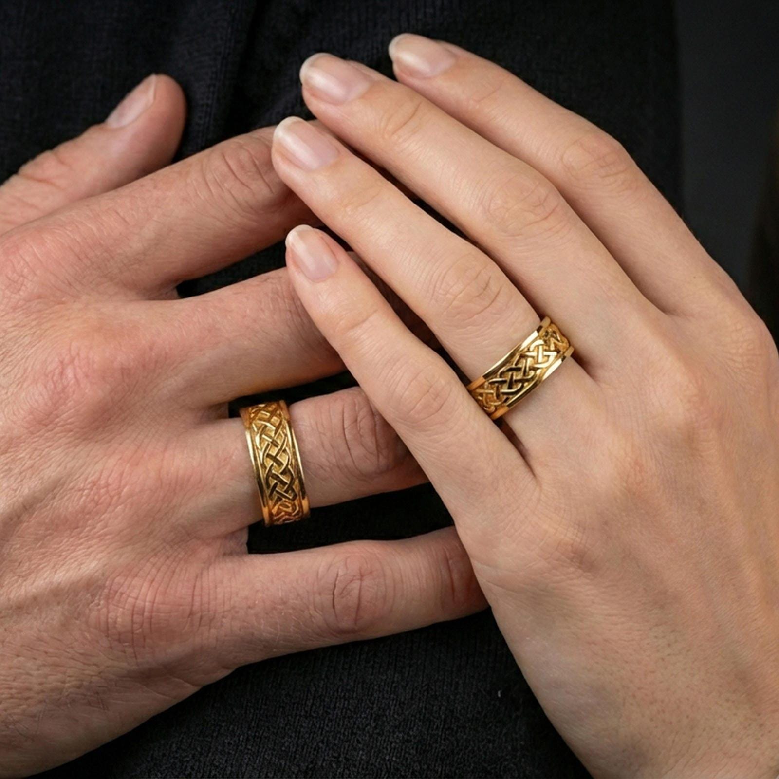 Sterling silver Celtic knot band ring worn on a finger, gold plated look for a bold statement while preserving the braided Celtic design clarity.
