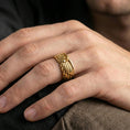 Load image into Gallery viewer, Angel wing sterling silver band ring worn on a finger, gold plated finish delivering a statement style while keeping the wing relief sharp.
