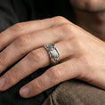 Load image into Gallery viewer, Angel wing sterling silver band ring worn on a finger, polished silver finish with a clean modern shine and smooth comfort-fit profile.
