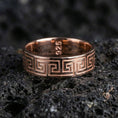 Load image into Gallery viewer, Rose gold plated sterling silver Greek key band on volcanic stone, sharp geometric meander engraving, minimal high-end close-up.
