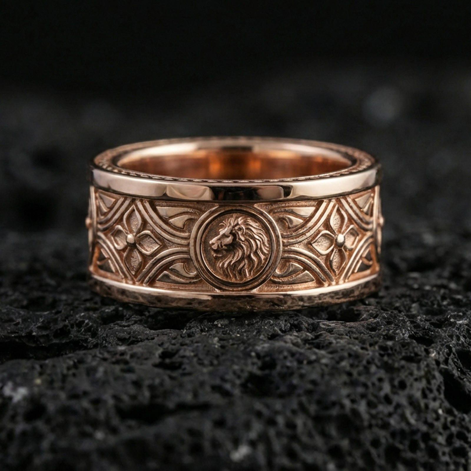 Rose gold plated sterling silver lion head band on volcanic stone, detailed lion relief and symmetrical Gothic engraving, minimal high-end close-up.