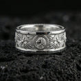 Load image into Gallery viewer, Polished silver lion head medallion band on black volcanic stone, crisp ornamental scrollwork and geometric accents, centered close-up studio lighting.
