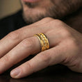Load image into Gallery viewer, Gold plated serpent skin band worn on finger, detailed scaled texture and rope edge trim, premium lifestyle jewelry photo.
