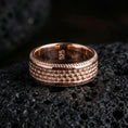 Load image into Gallery viewer, Rose gold plated sterling silver beaded texture band on volcanic stone, raised dot pattern with deep contrast and ridged edges, minimal high-end close-up.
