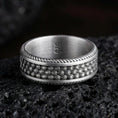 Load image into Gallery viewer, Oxidized sterling silver beaded dot texture band ring on dark volcanic rock, hammered bubble pattern with rope edge border, premium macro product shot.
