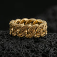 Load image into Gallery viewer, Gold plated Cuban link chain ring on volcanic rock, detailed interlocking links with engraved pattern, luxury jewelry product photography.
