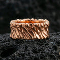 Load image into Gallery viewer, Rose gold plated sterling silver twisted rope band on volcanic stone, sculpted spiral texture with strong contrast and rugged finish, minimal high-end close-up.
