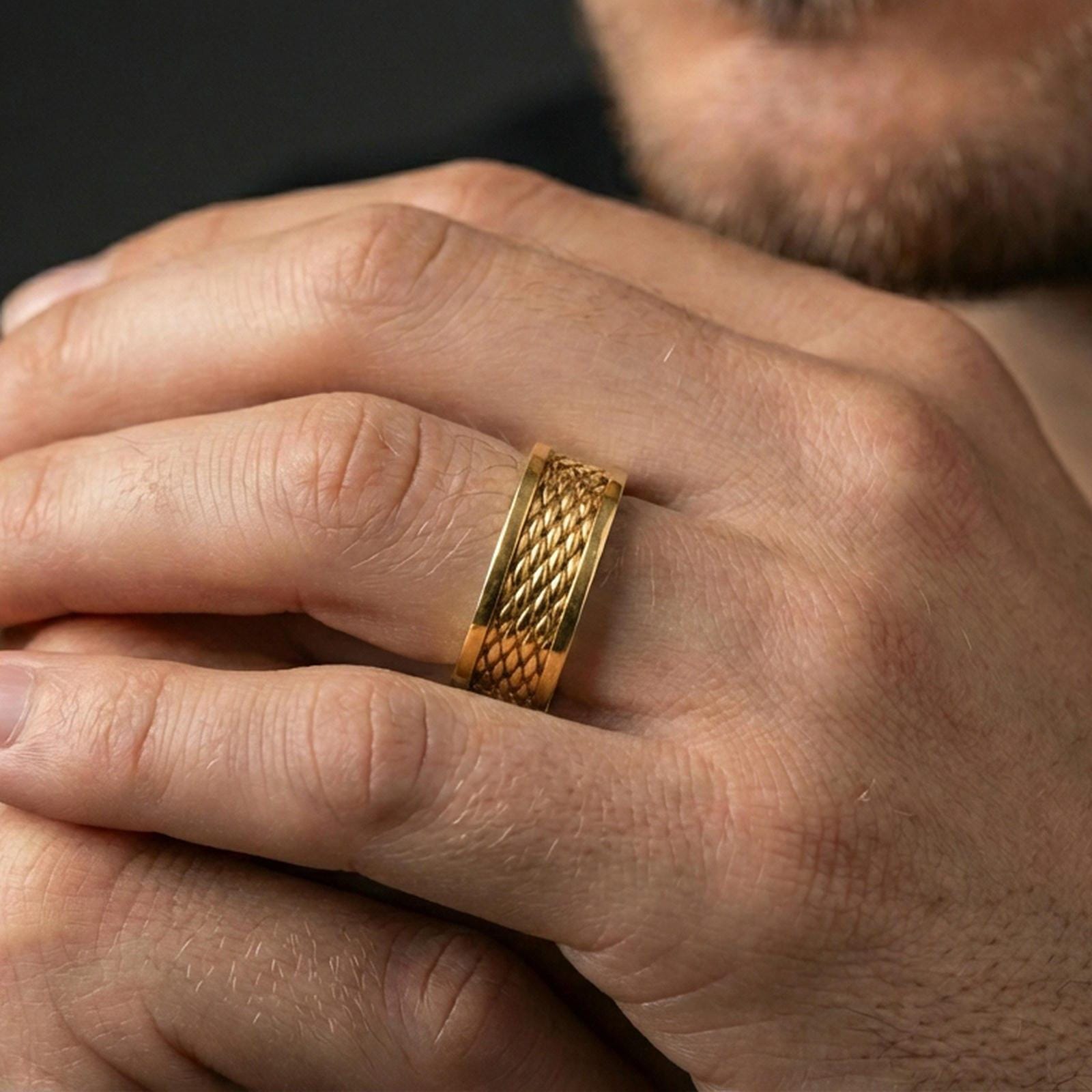 Gold plated braided rope texture band worn on finger, detailed woven pattern with clean borders, premium lifestyle jewelry photo.