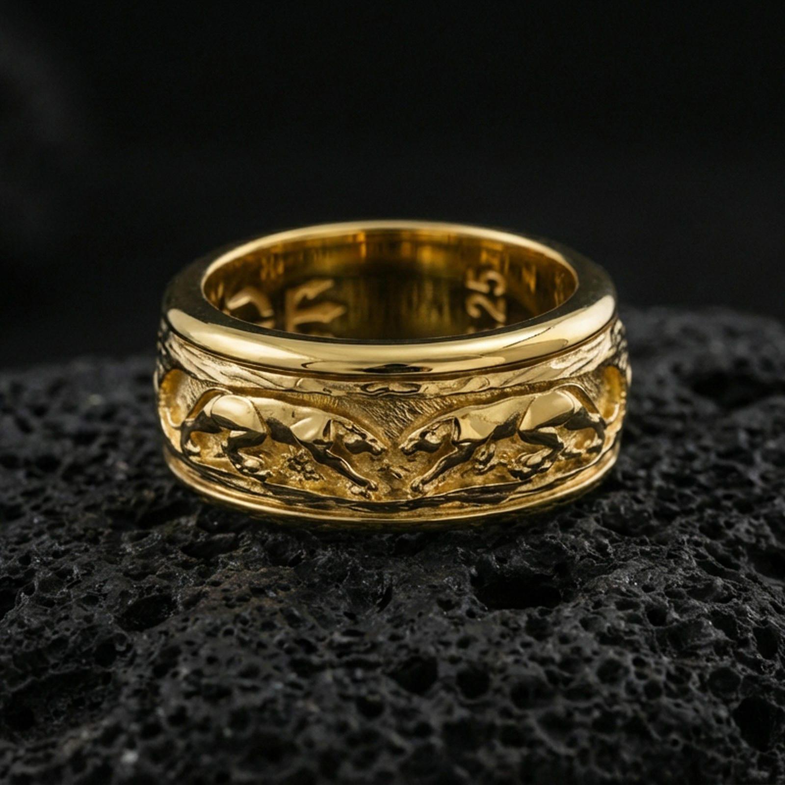Gold plated jaguar spinner band ring on volcanic rock, detailed big cat engraving on rotating center with rugged texture, luxury jewelry product photography.