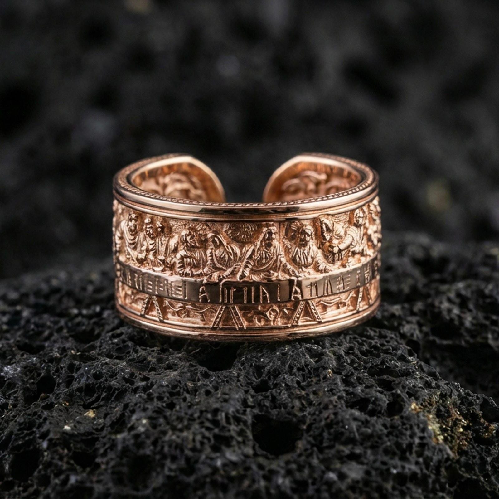 Rose gold plated sterling silver Last Supper band on volcanic stone, sculpted apostle scene relief with deep contrast and clean borders, minimal high-end close-up.