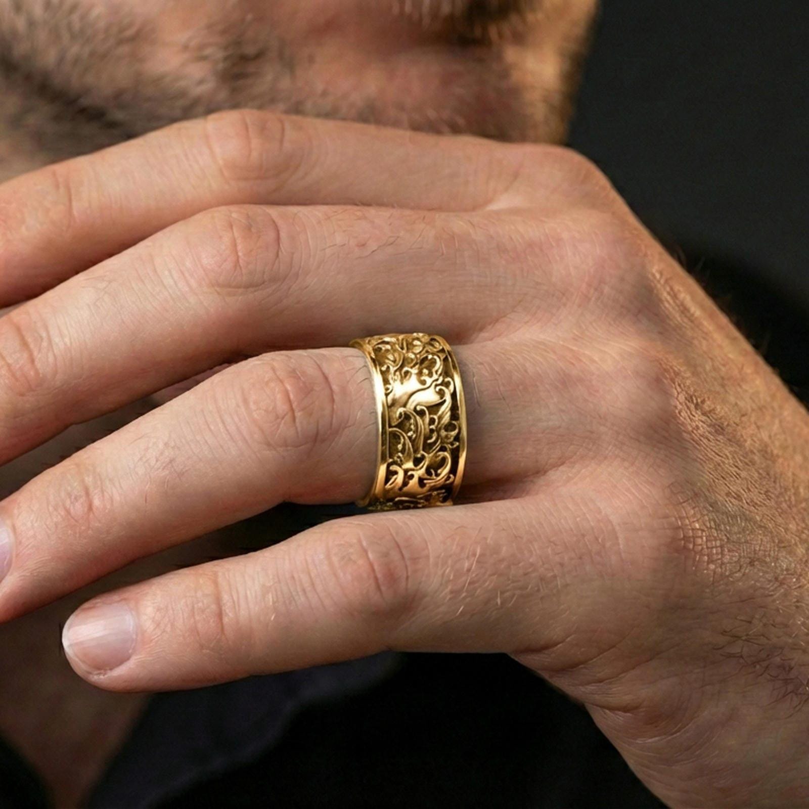 Gold plated swirling flames band worn on finger, detailed fire wave relief with bold depth, premium lifestyle jewelry photo.