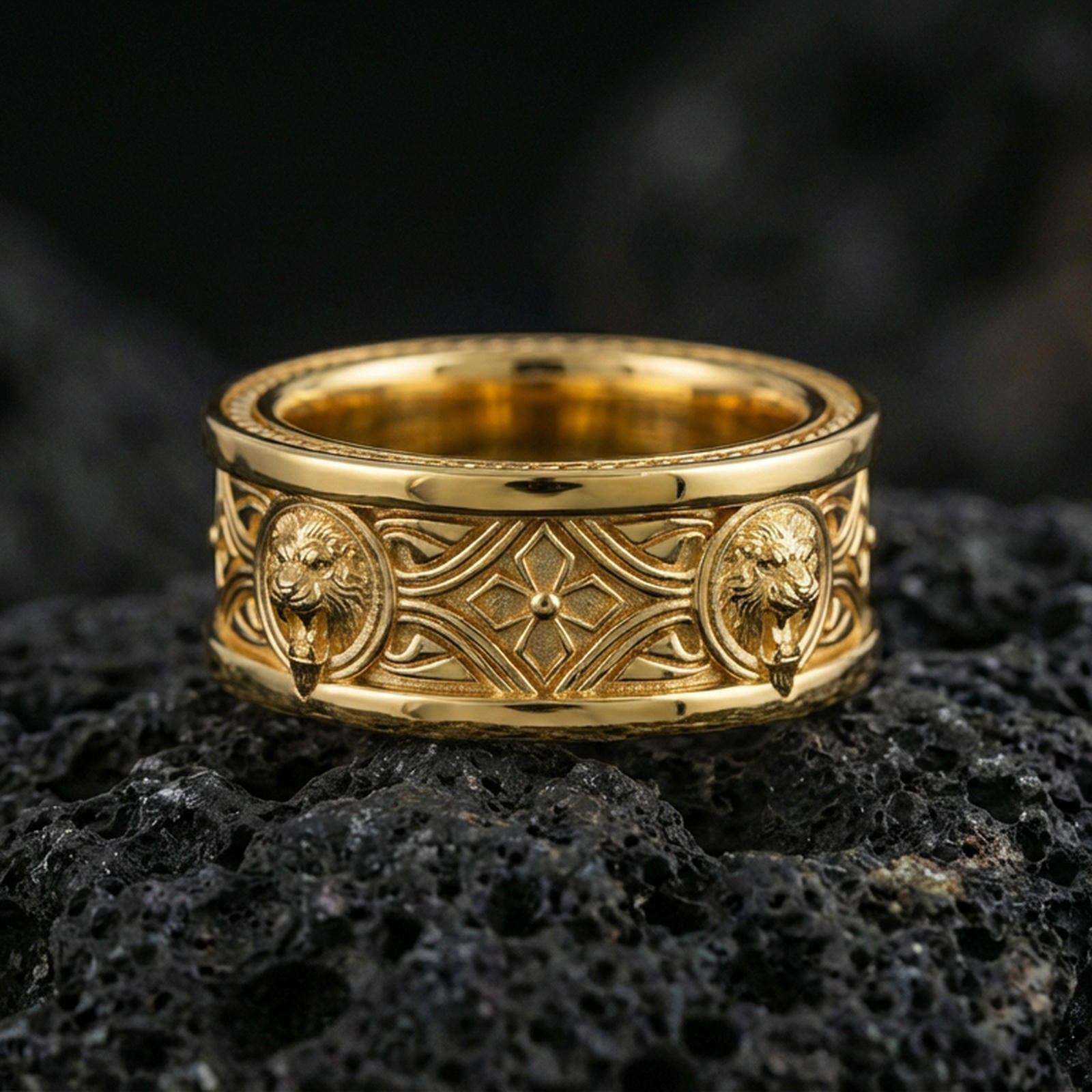 Gold plated lion medallion band ring on volcanic rock, detailed lion head relief panels with gothic cross centerpiece, luxury jewelry product photography.