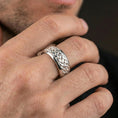 Load image into Gallery viewer, Polished silver braided interlace band worn on finger, clean reflective weave texture, natural everyday wear shot.
