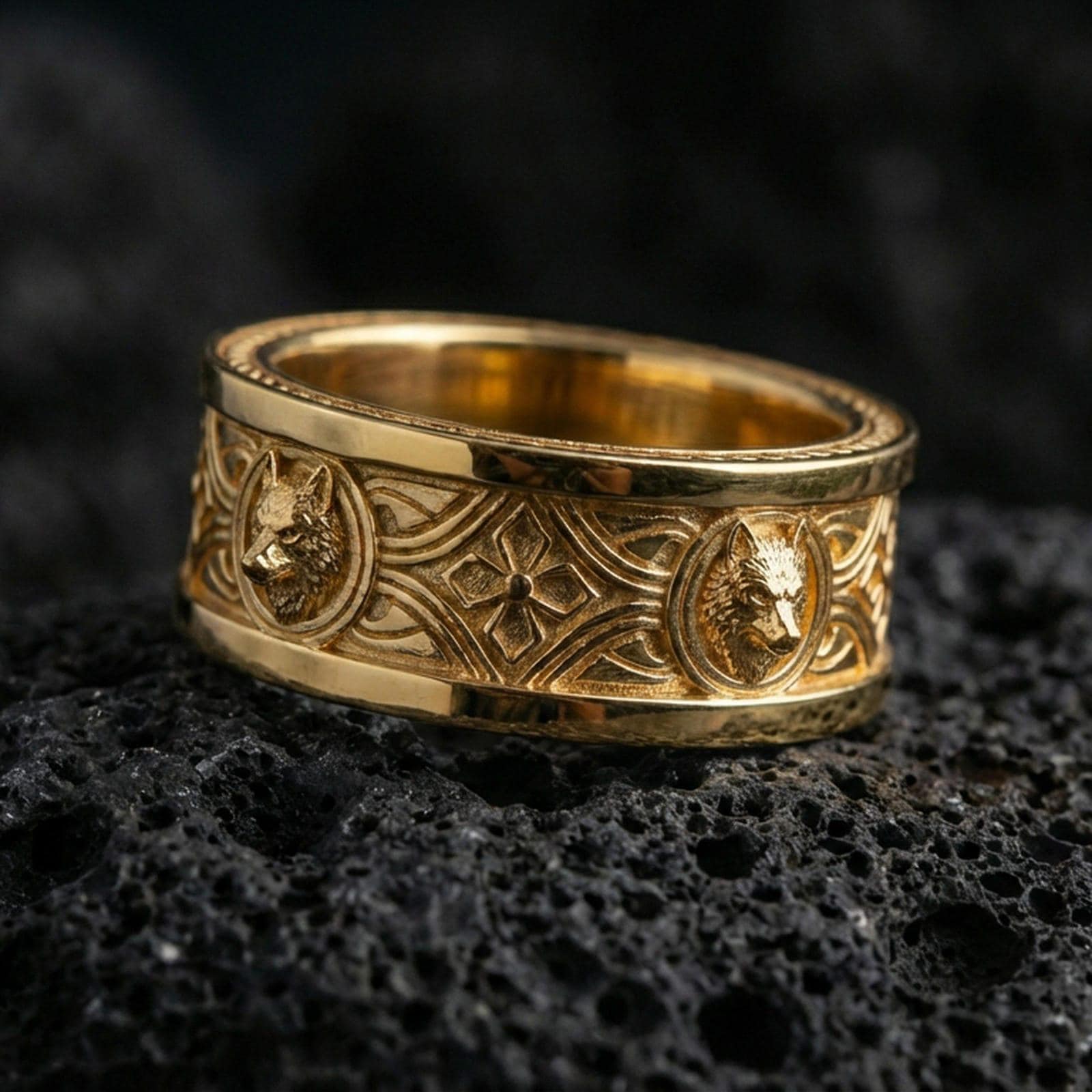 Gold plated wolf ring on volcanic rock, Celtic knot pattern with bold wolf emblems and rich metallic highlights, luxury studio macro.