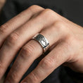 Load image into Gallery viewer, Polished silver Tree of Life band worn on finger, bright clean finish with crisp engraved detail, everyday wear photo.
