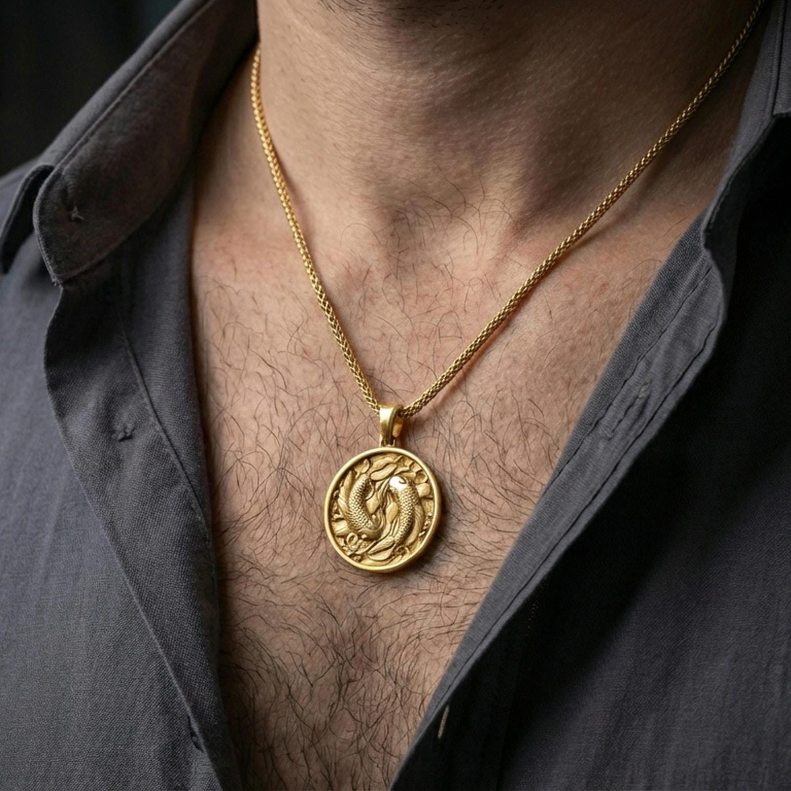 Gold plated koi fish pendant with twin swimming fish and symbolic round design worn on the neck in a premium lifestyle composition with elegant spiritual jewelry styling