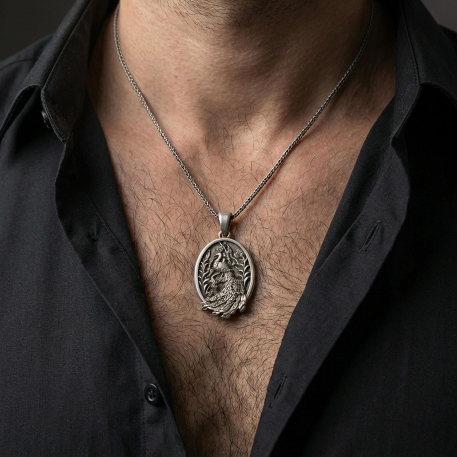 Oxidized peacock pendant with ornate feather detail worn on the neck in a lifestyle jewelry shot, styled against the chest for a graceful and nature-inspired look