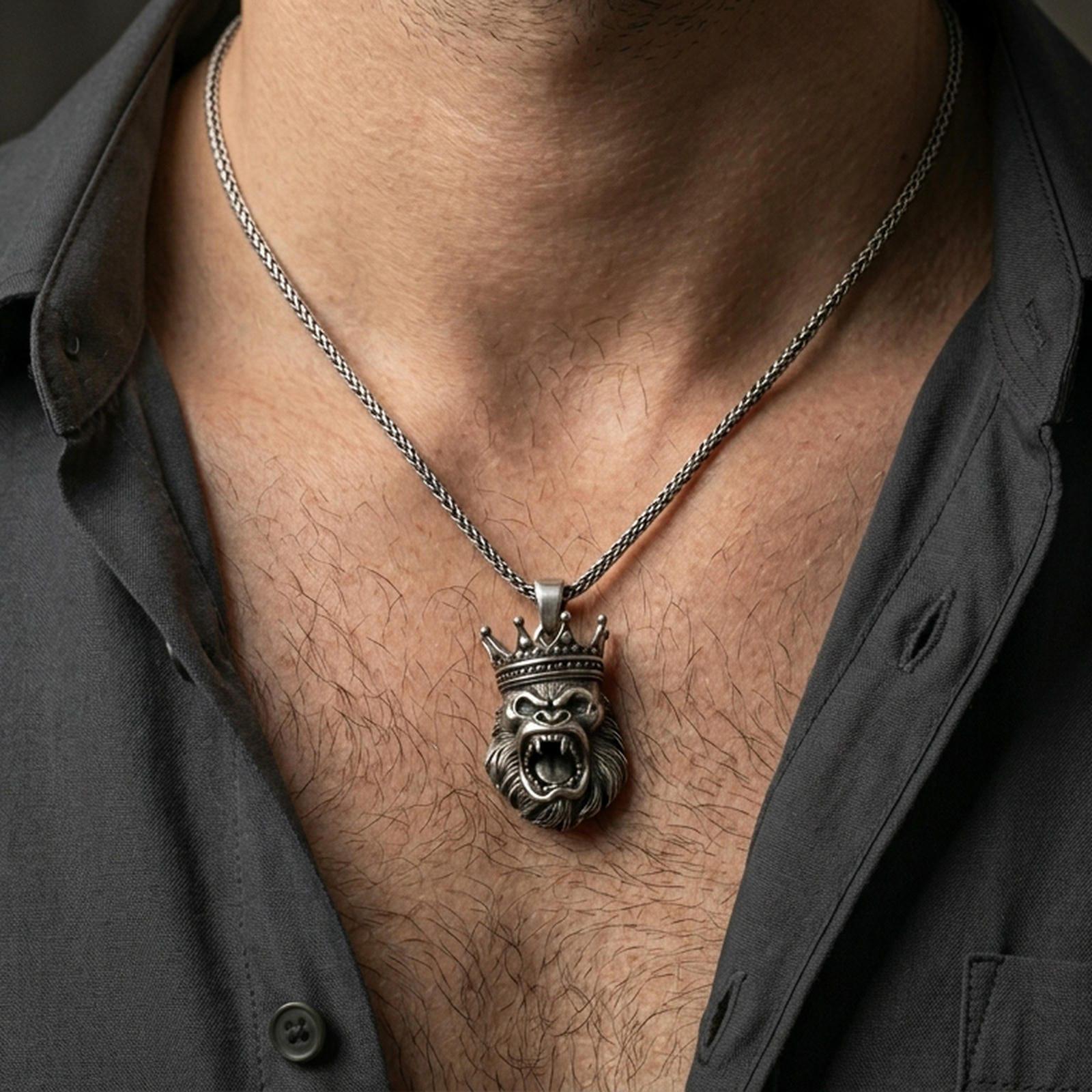 Oxidized gorilla king pendant with roaring crowned ape design worn on the neck in a lifestyle jewelry shot, styled against the chest for a bold and dominant statement look