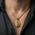 Load image into Gallery viewer, Gold plated owl pendant with intricate plumage and oval symbolic design worn on the neck in a premium lifestyle composition with graceful bird-inspired jewelry styling
