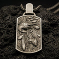 Load image into Gallery viewer, Bronze swordfish pendant with detailed ocean scene worn on the neck in a lifestyle jewelry shot, styled against the chest for a bold and marine-inspired statement look
