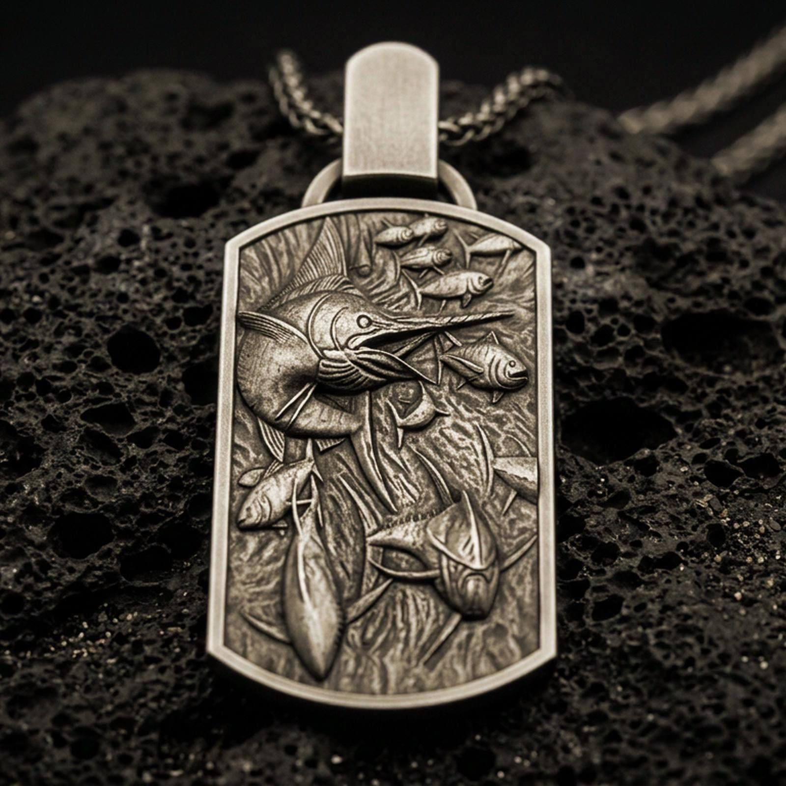 Bronze swordfish pendant with detailed ocean scene worn on the neck in a lifestyle jewelry shot, styled against the chest for a bold and marine-inspired statement look