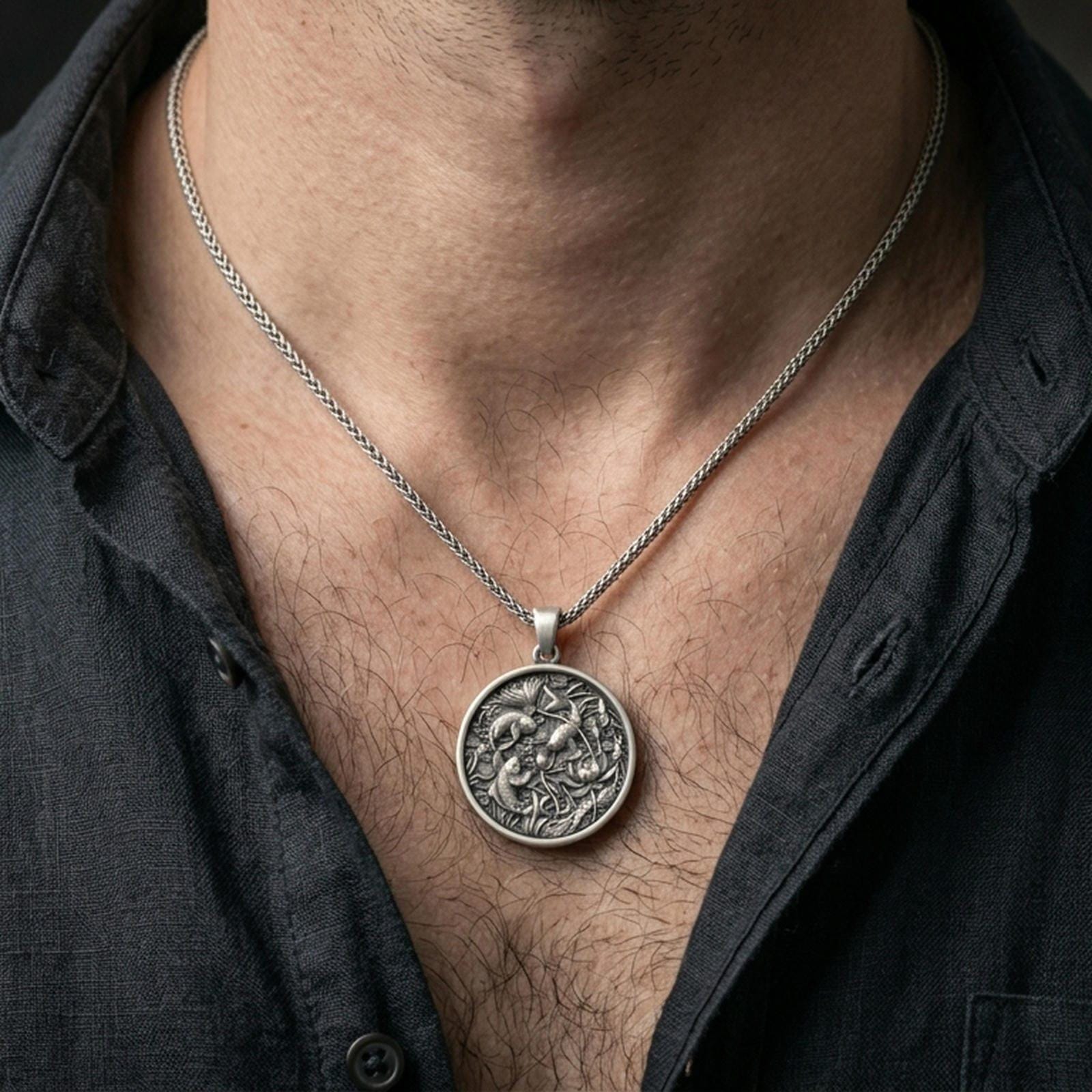 Oxidized koi fish pendant with lotus pond scene worn on the neck in a lifestyle jewelry shot, styled against the chest for a symbolic and nature-inspired statement look