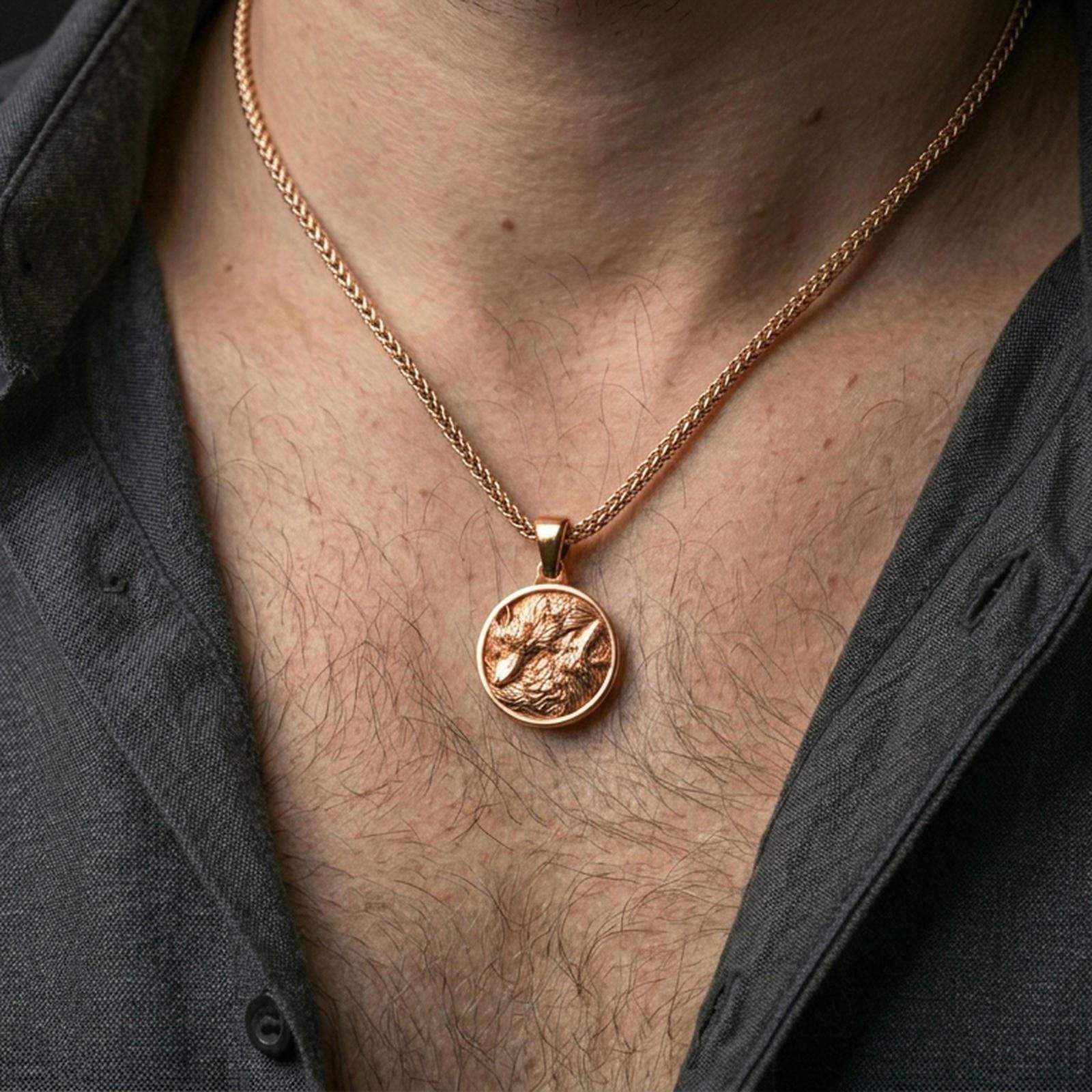 Rose gold plated wolf necklace with dual wolf relief, flowing fur composition, and elegant medallion silhouette worn on the neck in a refined lifestyle shot with a warm and sophisticated presentation