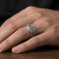 Load image into Gallery viewer, Oxidized sterling silver Celtic knot iron cross band worn on finger, vintage darkened relief showcasing the cross medallion and braided edges.
