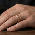 Load image into Gallery viewer, Rose gold plated Celtic weave iron cross ring worn on finger, refined warm glow with crisp knot engraving and smooth rounded edges.
