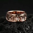Load image into Gallery viewer, Rose gold plated Benjamin Franklin portrait band on volcanic rock, soft warm glow enhancing the raised facial features and vintage texture.
