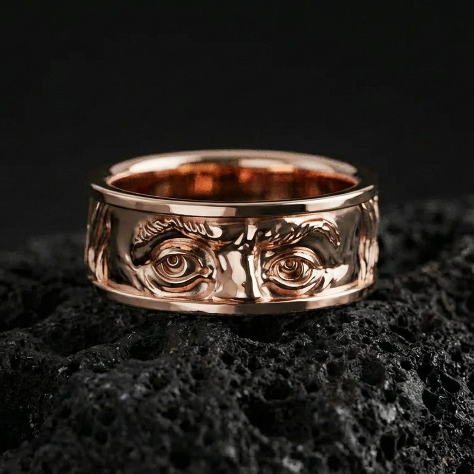 Rose gold plated Benjamin Franklin portrait band on volcanic rock, soft warm glow enhancing the raised facial features and vintage texture.