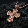 Load image into Gallery viewer, Holy Trinity cross pendant on volcanic stone in a rose gold plated look, bringing warmth to the engraved sacred motifs.
