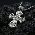 Load image into Gallery viewer, 925 sterling silver Holy Trinity cross pendant on volcanic rock with a clean polished shine highlighting the carvier edges.
