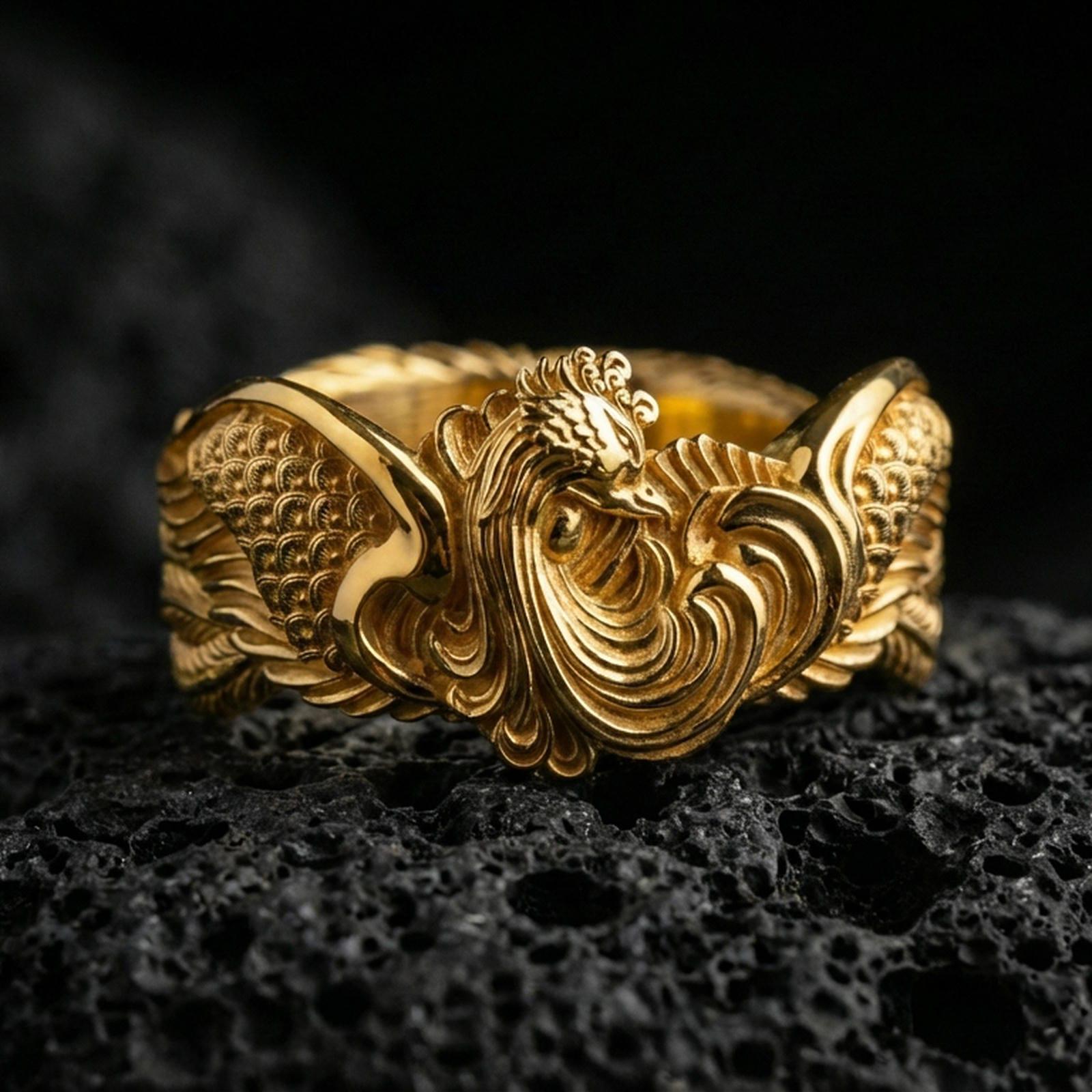 Rooster motif ring displayed on volcanic rock with a gold plated finish, bringing out the layered feather texture and raised centerpiece.