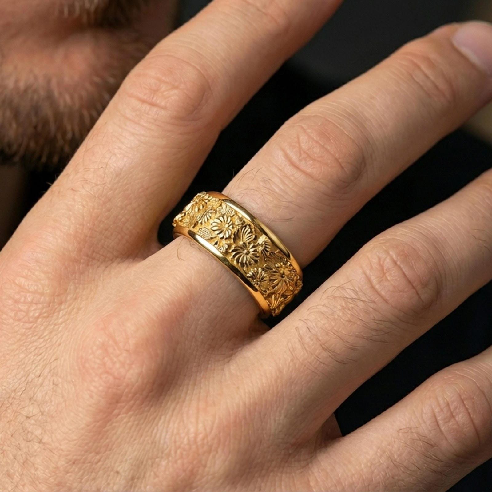 Gold plated daisy spinner ring worn on a finger, warm reflective finish highlighting the floral design and spinning comfort band.