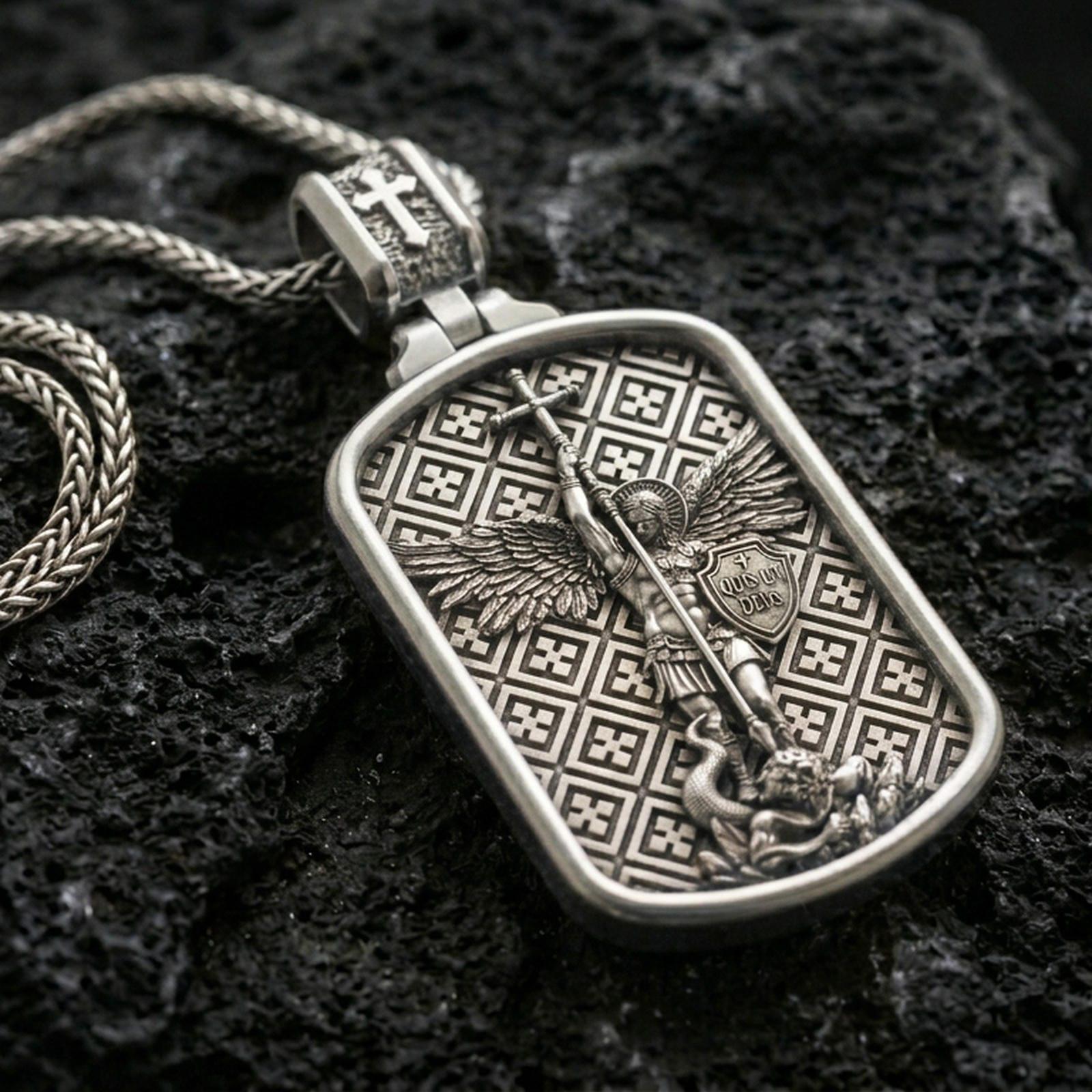 925 sterling silver Saint Michael dog tag necklace on volcanic rock with a clean polished shine highlighting the border and relief.