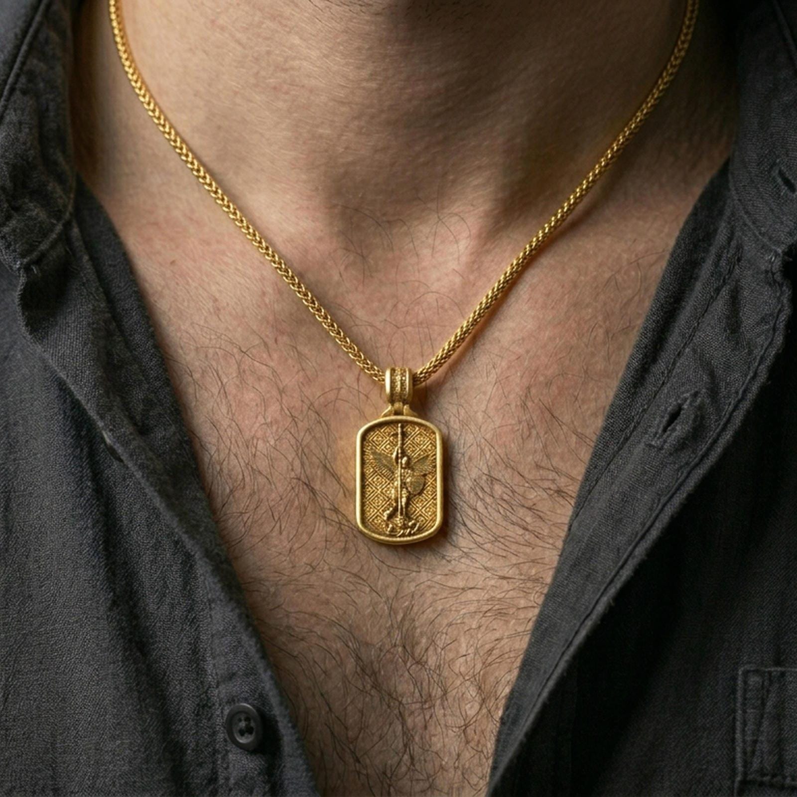 Saint Michael dog tag pendant worn on the neck, angled view highlighting thickness, bail cross detail, and premium craftsmanship.