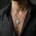Load image into Gallery viewer, Polished silver gorilla necklace with detailed roaring primate relief and oval medallion shape worn on the neck in a close lifestyle frame, highlighting the sculpted fur texture and powerful animal symbolism
