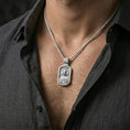 Load image into Gallery viewer, Polished silver Christian Jesus pendant with Sacred Heart relief worn on the neck in a close lifestyle frame, highlighting the detailed portrait and spiritual symbolism
