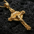 Load image into Gallery viewer, Gold plated Jesus cross pendant with ornate decorative ends, raised corpus relief, and INRI inscription showcased on black volcanic rock in a refined macro jewelry image
