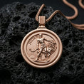 Load image into Gallery viewer, Rose gold plated Lion of Judah spinner pendant with detailed lion figure, round border, and symbolic engraved scene resting on volcanic rock in an elegant close-up product presentation

